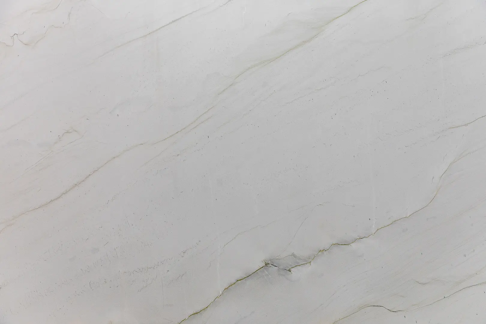 Mont Blanc Honed Quartzite is a bright and white quartzite reminiscent of a serene streaking marble. Perfect for indoor/outdoor countertops, bathrooms, and much more!