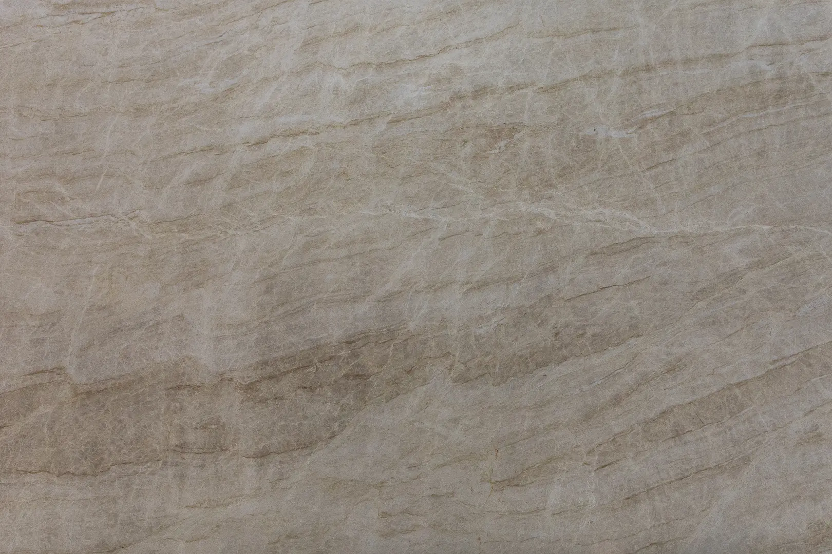 Premium Taj Mahal Quartzite slab featuring soft beige and ivory tones with delicate golden veining. Elegant natural stone ideal for countertops and luxury interiors.