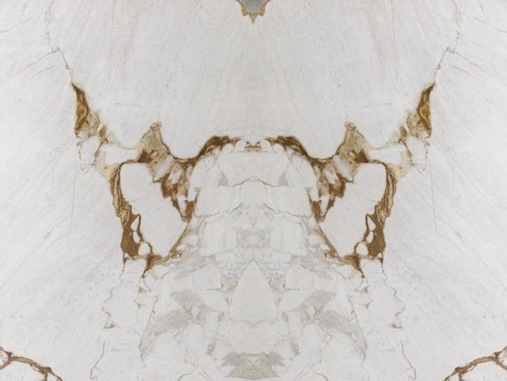 Bookmatched Michael Angelo natural stone slabs. Beautiful white dolomite with gold and grey vein pattern.